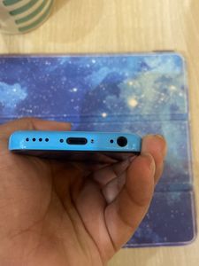 I Phone 5c With Cover and Earphones