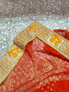 very pretty bandhani orange saree