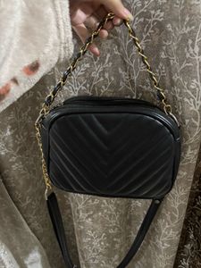 A black crossbody bag