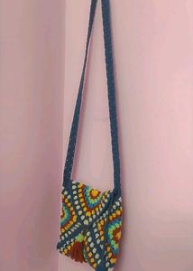 beautiful adjustable crochet sling.