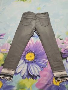 Gray Denim Jeans with Pom-Pom Detail
