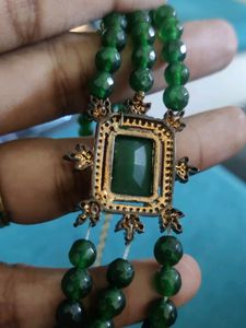 3 line Emerald chain with a locket.
