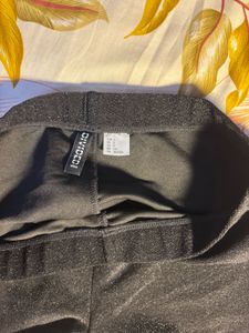 hnm black glittery flare pants