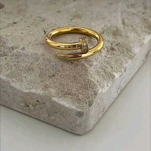 Gold Nail Ring with AD Stones
