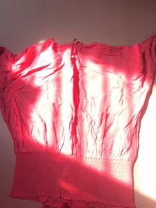 pink stretchy top with flowers embodery
