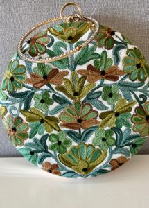 NEW round embroidered look bag