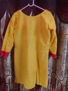 Yellow Kurti With Pink Thread Work