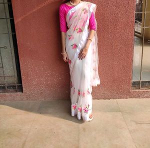 Embroidered netted saree with boat neck bl