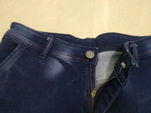 Blue Jeans With Two Red Stripes On Sides
