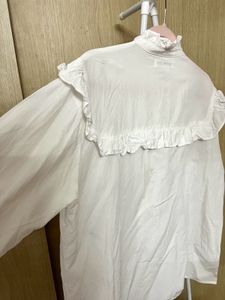 Elegant White Ruffle Blouse with High Neck Detail