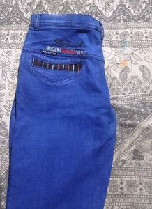 Unique Blue Jeans with Striped Pocket Detail