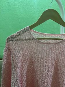 pink open-knit sweater
