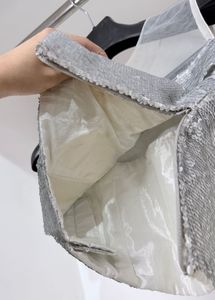 Silver flip‑sequin padded crop top