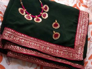 Elegant Green Saree with Pink Border