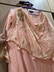 peach gown with cowl and attached drape