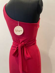 Red one shoulder slit dress