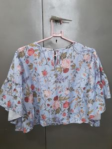 This is a Top From Sassafras . It Is Blue In Colour With Floral Print On It . Sixe Is XL