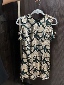 Embellished bodycon cold shoulder dress.