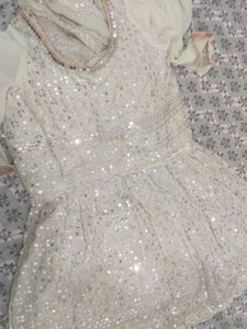 A Light green Sharara suit