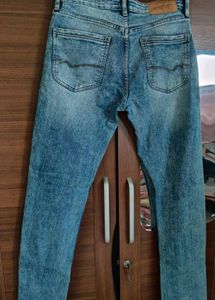 Distressed Blue Denim Jeans
