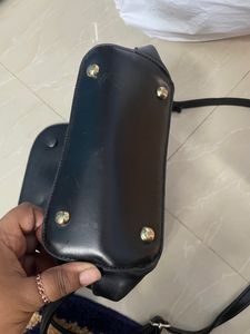 Black Sling Bag From Ajio. This Sling Is Sturdy and Useful For Keeping A Small Purse Along With Two Phones And Other Small Items. Bag Has 5 Compartments.