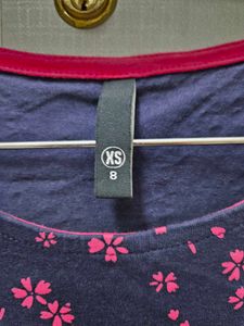 A Navy Blue Shirt With Pink Printed Flowers