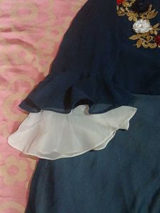 a gown with georgette fabric blue nd white colour