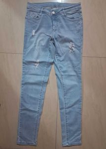 Distressed Light Wash Denim Jeans