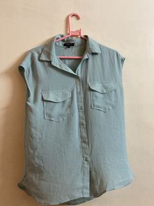 Light Blue Sleeveless Button-Down