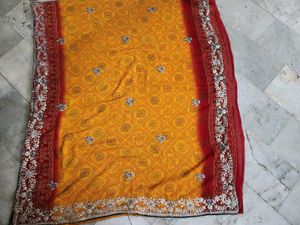 Red and yellow bandhni saree