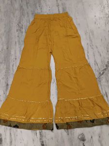 Girls wear Mustard Embroidered A-Line Kurta with s