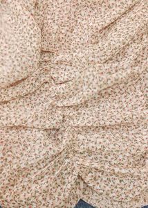 nude floral ruched mini dress with puff sleeves