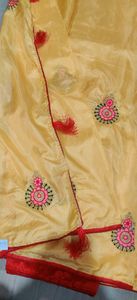 musk melon colour traditional saree with latkans and butas comes with red blouse