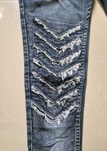 Trendy Distressed Denim Jeans with Chevron Design