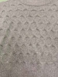 girls woolen sweater of white colour