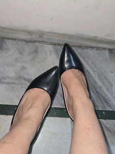 used red bottom black pointed heels