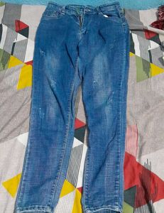 Distressed Blue Denim Jeans