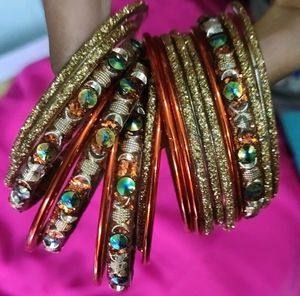 Orange And Golden Colour Bangles