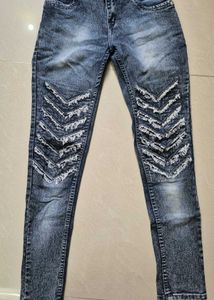 Trendy Distressed Denim Jeans with Chevron Design