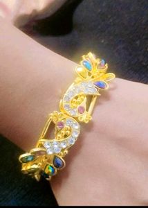 Elegant Gold-Tone Peacock Bracelet