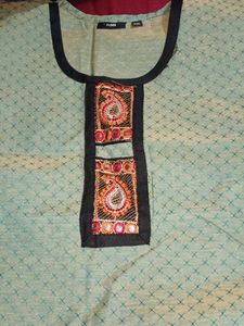 Green Embroidered Kurti with attractive design in