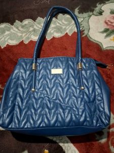 Blue Quilted Handbag of Nelle Harper
