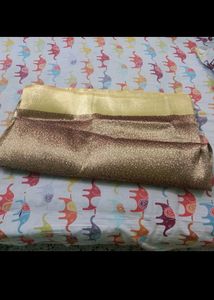 Golden Zari Knitting Work On Brown Base saree