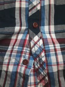 Stylish boys&#39; plaid shirt with an attached hoodie.