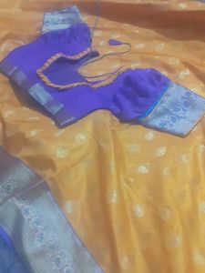 mango colour saree with ready stitched pattern blouse....