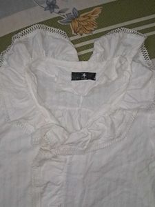 White frilled top
