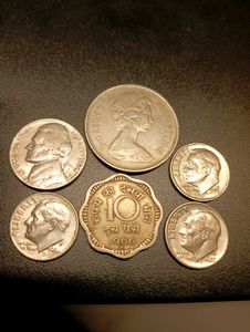 5 Foreign And 1 Indian coins.
