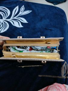 A brand new sparkly gold clutch