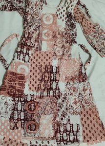 Frock with Peach and brown designs and a short frock its size 30