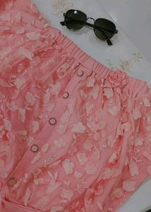 skirt or shorts with floral embellishments.